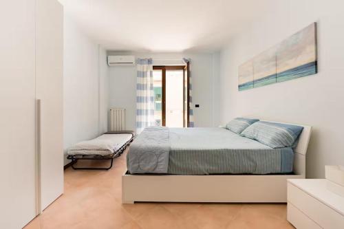 Ένα ή περισσότερα κρεβάτια σε δωμάτιο στο Bluemar Guest House