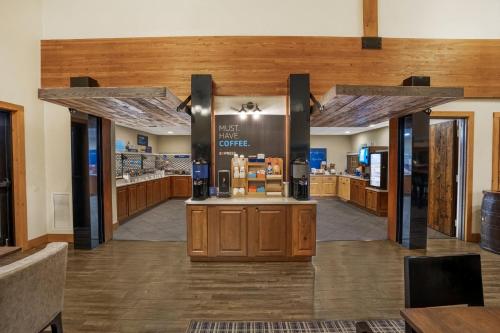 a view of a coffee shop with wooden walls at Holiday Inn Express & Suites Hayward by IHG in Hayward