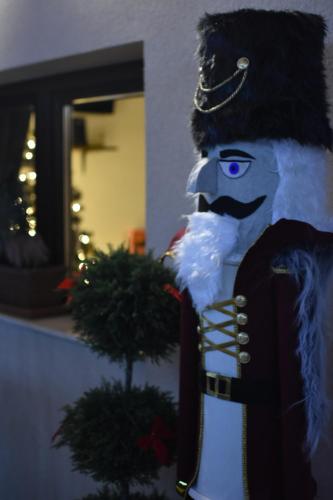 a statue of a snow man with blue eyes at Gímes Apartman in Cserszegtomaj