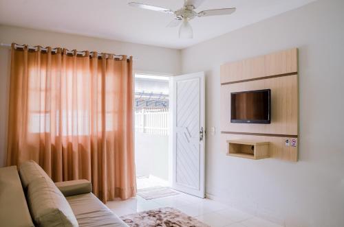 TV a/nebo společenská místnost v ubytování Residencial Gonçalves I