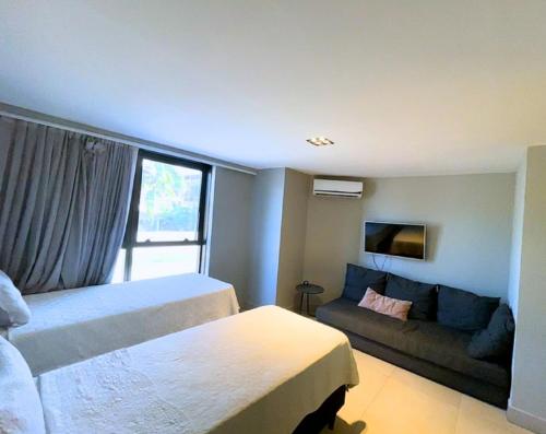 Cama o camas de una habitación en Flat completo no Infinity at the sea