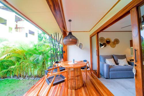 a living room with a table and a couch at Wabi Sabi Sora in Punta Uva