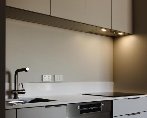 a kitchen with a sink and a counter top at Apartment 2 Hospital Road Wellington in Wellington