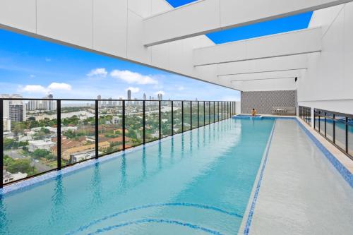 a swimming pool on top of a building with a view at Stay Luxe Southport - Hosted by Coastal Letting Co. in Gold Coast