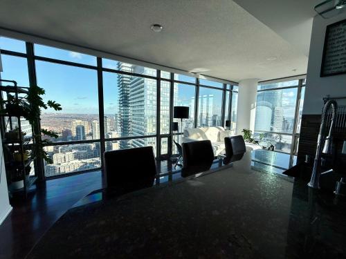 a living room with a view of a city at 44th Floor, Panoramic Views, Bay Corridor Downtown Toronto Condo in Toronto