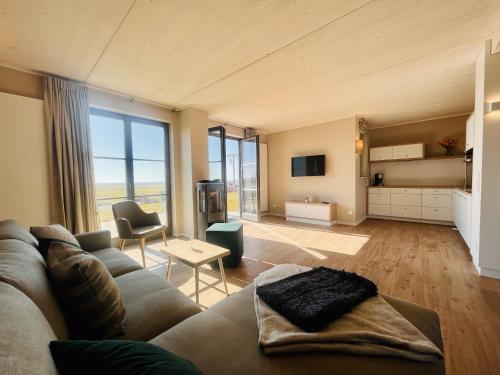 Ένα ή περισσότερα κρεβάτια σε δωμάτιο στο Ferienhaus Seeblick 19 Feriendorf Klein Stresow Rügen by ruyastay