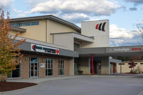 an exterior view of a building with an indiger arena at Staybridge Suites Raleigh-Durham Airport-Morrisville by IHG in Morrisville