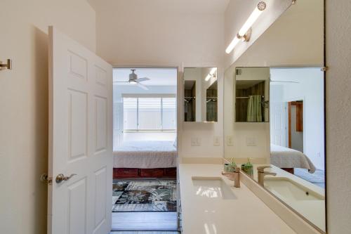 a bathroom with a sink and a mirror at Red Rox Phoenix Condo with Patio about 3 Mi to Airport in Phoenix