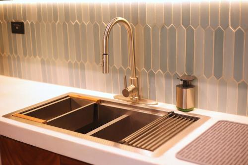 a kitchen sink with a faucet on top of it at Wabi Sabi Sora in Punta Uva
