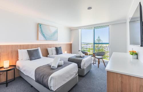 Postel nebo postele na pokoji v ubytování Scamander Beach Resort