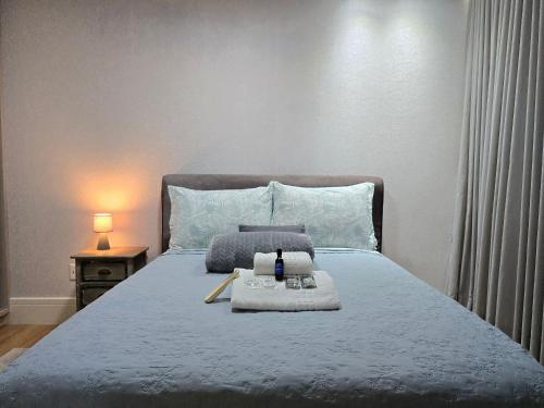 a bedroom with a bed with a tray of food on it at APT 804 - Brava Beach - 3 Quartos - 2 Vagas Garagem in Cabeçudas