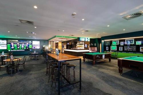 a gaming room with pool tables and billiards at Riverwood Hotel - Adults Only in Riverwood