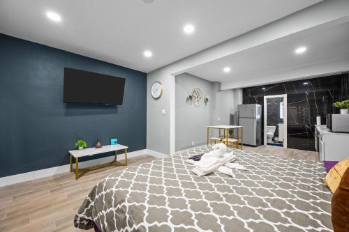 a bedroom with a teddy bear sitting on a bed at Charming Midtown Studio with Free Parking in Houston