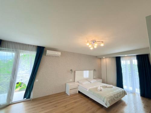 Postel nebo postele na pokoji v ubytování Guest House Bagrationi