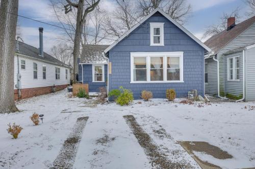 a blue house with snow on the ground at Patio and Lake Views Family-Friendly Canton Retreat in Canton