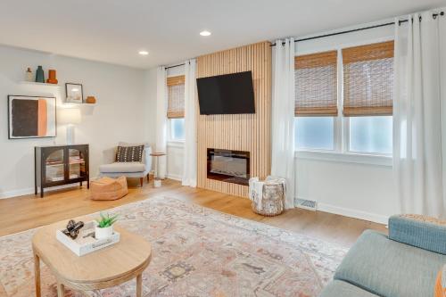 a living room with a couch and a table at Patio and Lake Views Family-Friendly Canton Retreat in Canton