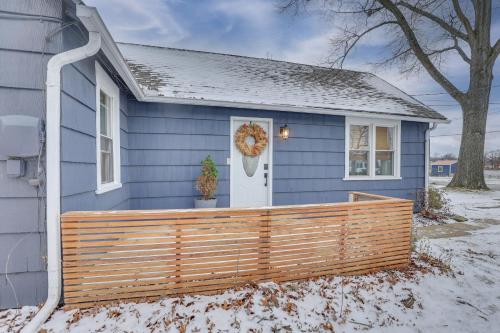 a blue house with a wooden fence in front of it at Patio and Lake Views Family-Friendly Canton Retreat in Canton