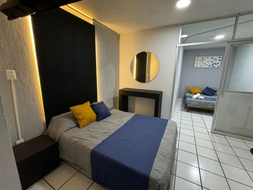 Postel nebo postele na pokoji v ubytování Hotel Urban Matamoros