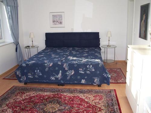 En eller flere senge i et værelse på Frisian house Wallsbuell