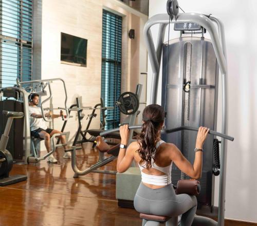 a group of people exercising in a gym at Fairmont Riyadh in Riyadh