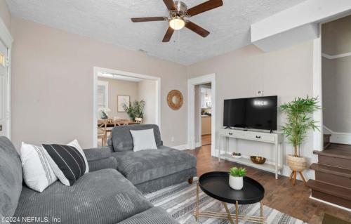 a living room with a couch and a flat screen tv at Riverside Craftsman with 3 beds and 3 baths, Pet friendly, Great neighborhood in Jacksonville