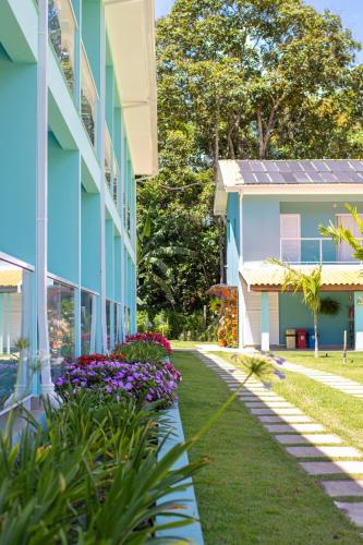 a building with solar panels on the side of it at Pousada Thermas das Montanhas in Águas de Lindóia