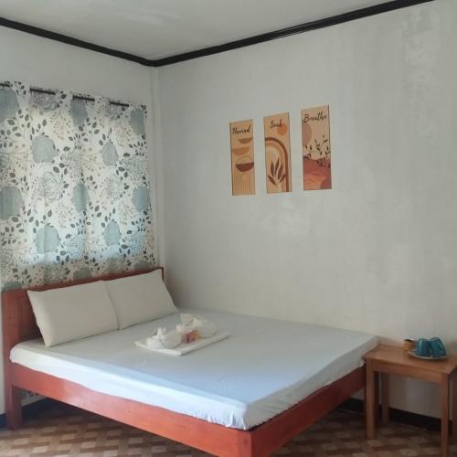 Ένα ή περισσότερα κρεβάτια σε δωμάτιο στο Noah Xye Guest House