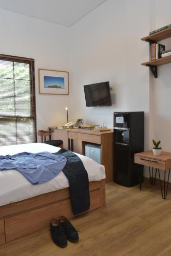 Postel nebo postele na pokoji v ubytování Rumanami Residence