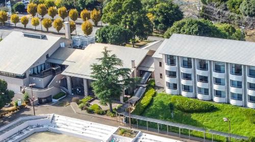 an aerial view of a building with a swimming pool at UE Garden Resort in Chiba