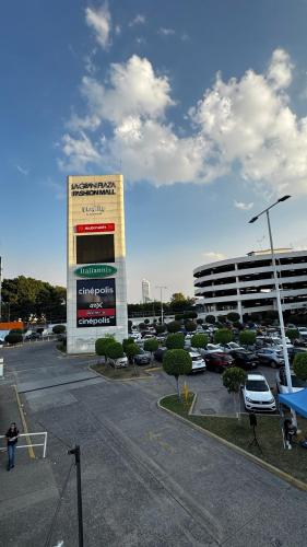 a parking lot in front of a car dealership at Hotel Nuevo Vallarta in Guadalajara