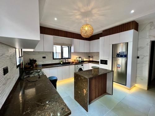 a large kitchen with a large counter in it at Masque Lagos in Lagos