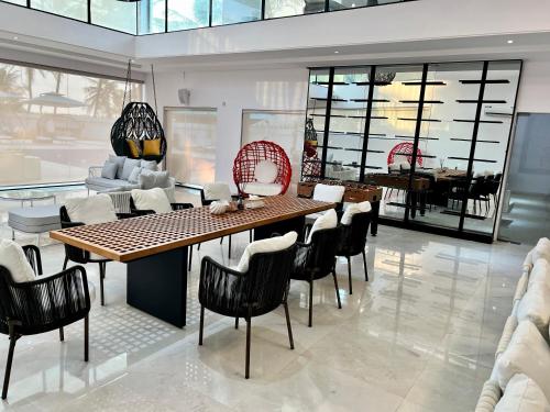 a dining room with a table and chairs at Masque Lagos in Lagos