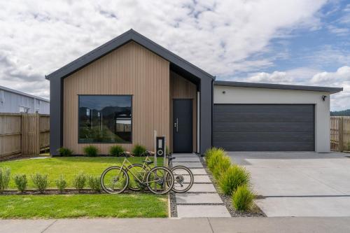 a couple of bikes parked in front of a garage at Karioi Mountain View in Raglan