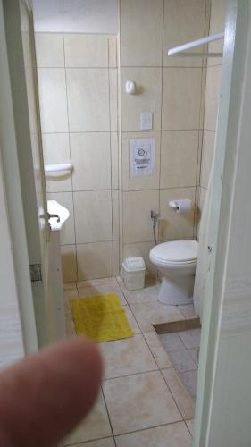 a bathroom with a toilet and a sink at Alojartur in San Rafael