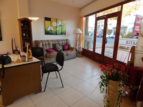a living room with a couch and a table at Alojartur in San Rafael