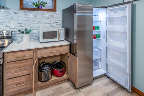 a kitchen with a refrigerator and a microwave at Family Stay! Near both Ark & Creation Museum! in Walton