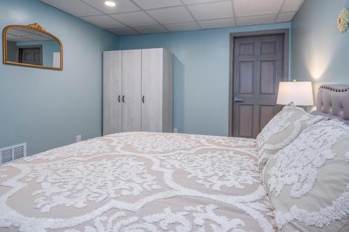 a bedroom with a large white bed with a mirror at Family Stay! Near both Ark & Creation Museum! in Walton