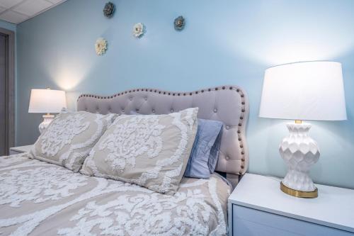 a bedroom with a white bed with two lamps on a nightstand at Family Stay! Near both Ark & Creation Museum! in Walton
