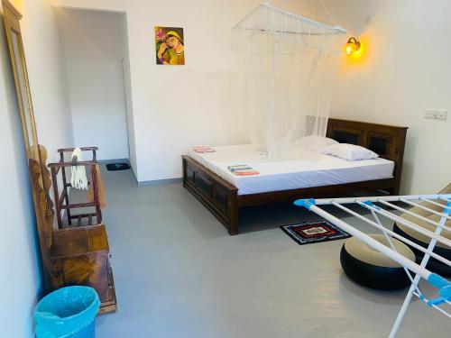 Postel nebo postele na pokoji v ubytování Bloom Guest House