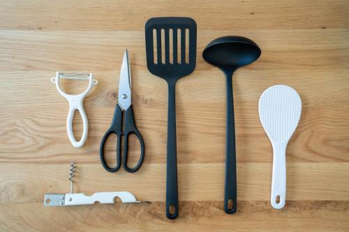 a group of utensils sitting on a wooden table at Altiplano in Sapporo