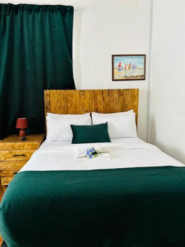 Katil atau katil-katil dalam bilik di Vuyomat Guest House 1