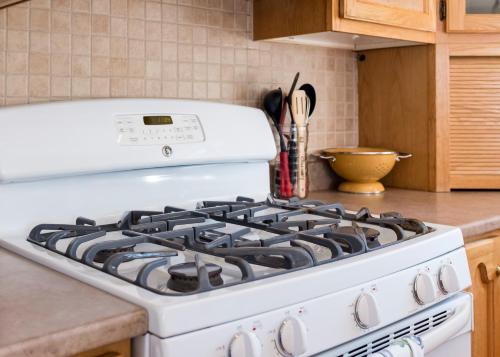 a white stove top oven in a kitchen at The Mooring Ocean Vw 3b Coastal Experience in Topsail