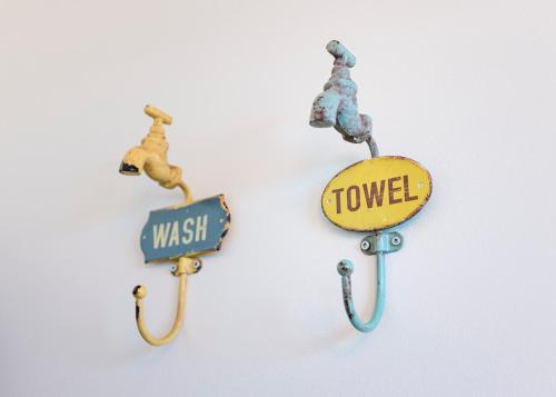 three street signs hanging on a wall at The Mooring Ocean Vw 3b Coastal Experience in Topsail