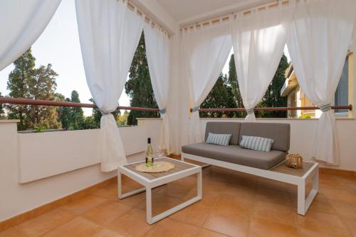 a living room with a couch and a table at Quiet Home in Pula