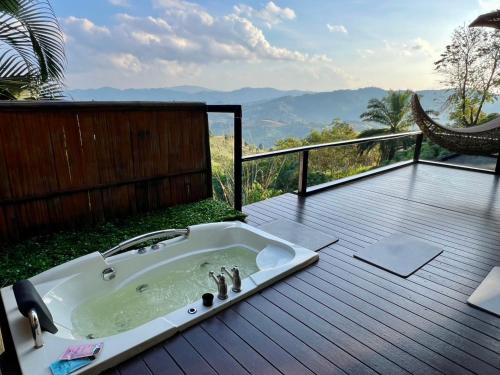 a bathroom sink on a deck with a view at Bella Lunar Villa ดอยแม่สลอง in Mae Salong