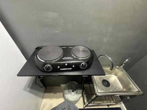 a toaster sitting on a counter next to a sink at Retreats at Fort-Lauderdale in Margate