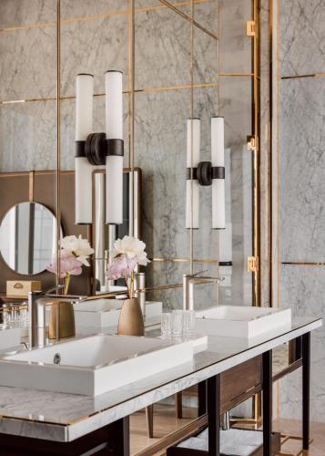 a bathroom with two sinks and a mirror at One&Only One Za'abeel in Dubai
