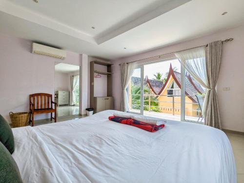 Katil atau katil-katil dalam bilik di Blue Lion Small Pool Villa - by KohChangVillas