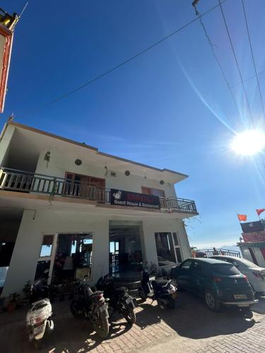 a building with motorcycles parked in front of it at Baakhli Guest House and Restaurant in Bhowāli