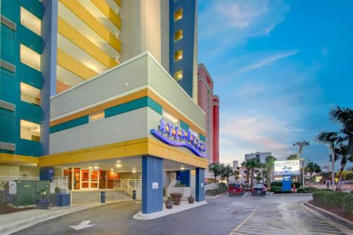 a large building on a street in a city at Stunning Views Atlantica Towers Condo in Myrtle Beach
